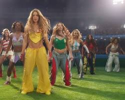 Why Shakira and Burna Boy’s "Dai Dai" Is the Biggest Song on the Planet Right Now 2 The image shows a vibrant, highly stylized promotional still or video capture from the "Dai Dai" music video, featuring Shakira and Burna Boy togethe