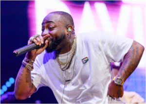 Davido, Nigerian Afrobeats singer and songwriter, performing on stage during a live music concert