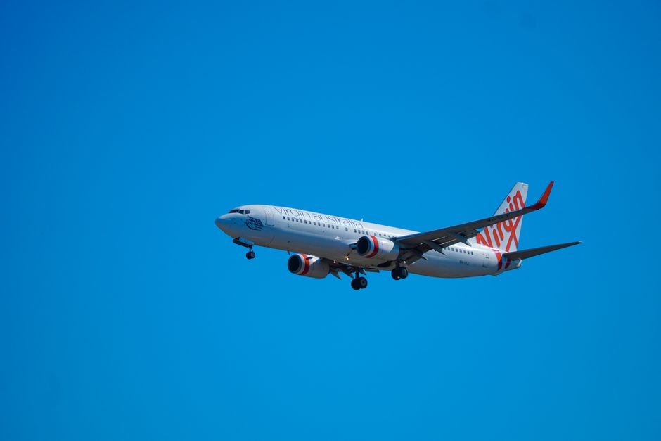 Best Flight Comparison Websites 2026 logos displayed on a laptop beside flight search results
