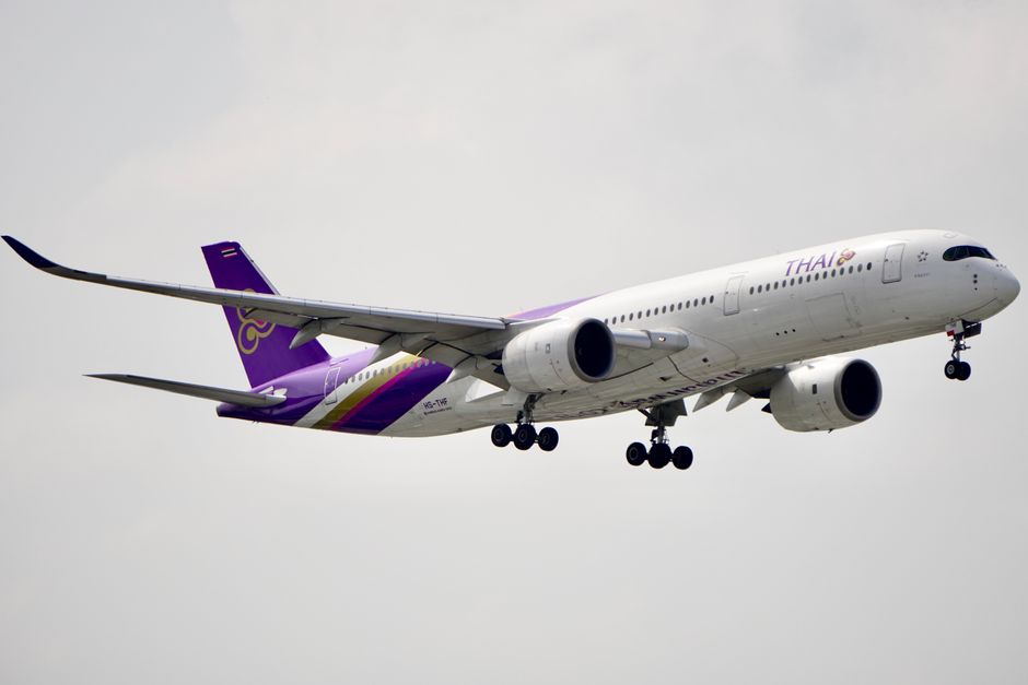 Best Flight Comparison Websites 2026 logos displayed on a laptop beside flight search results
