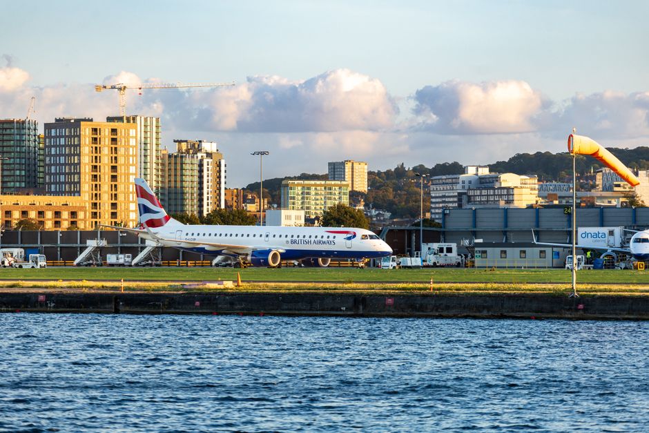 Cheap Flights To London From Lagos Checklist with airplane tickets and London skyline