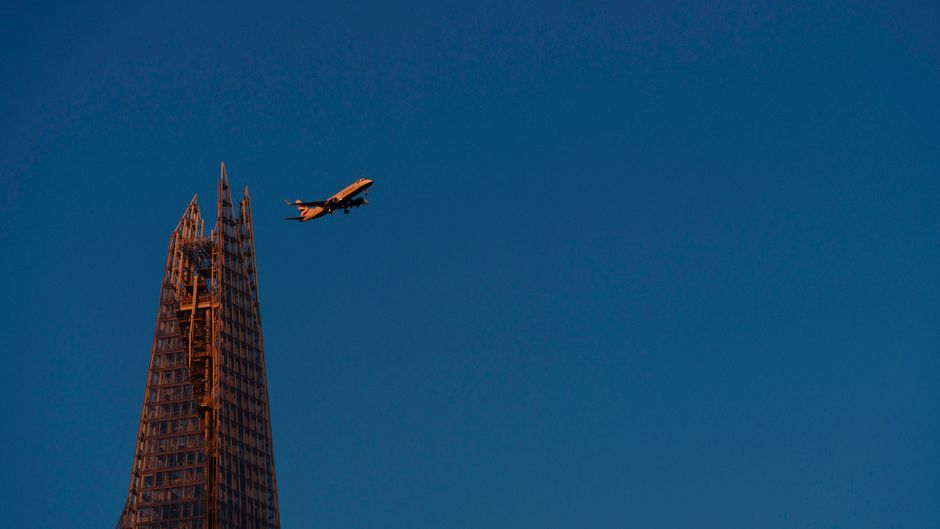 Cheap Flights To London From Lagos Checklist with airplane tickets and London skyline