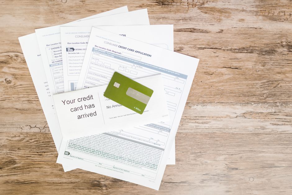Building Credit Score Fast As New Immigrant In Canada with a newcomer reviewing credit options