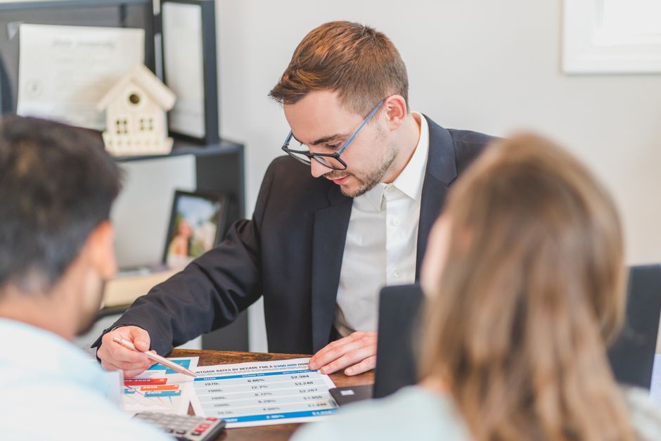 Mortgage Options For Foreign Workers In Uk And Canada: worker reviewing mortgage documents