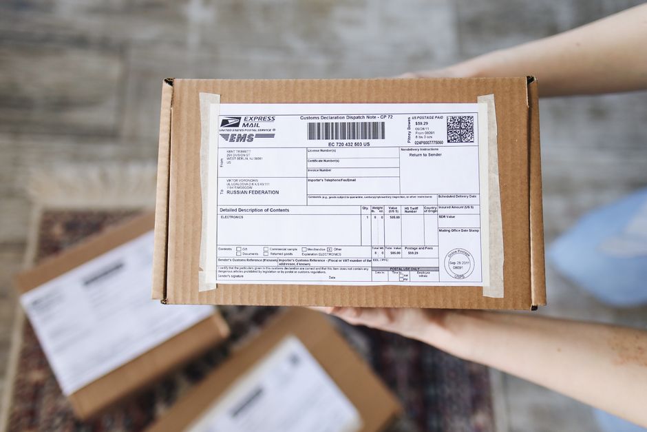 Shipping Personal Belongings To Canada Customs Declaration Costs calculator and forms desk scene