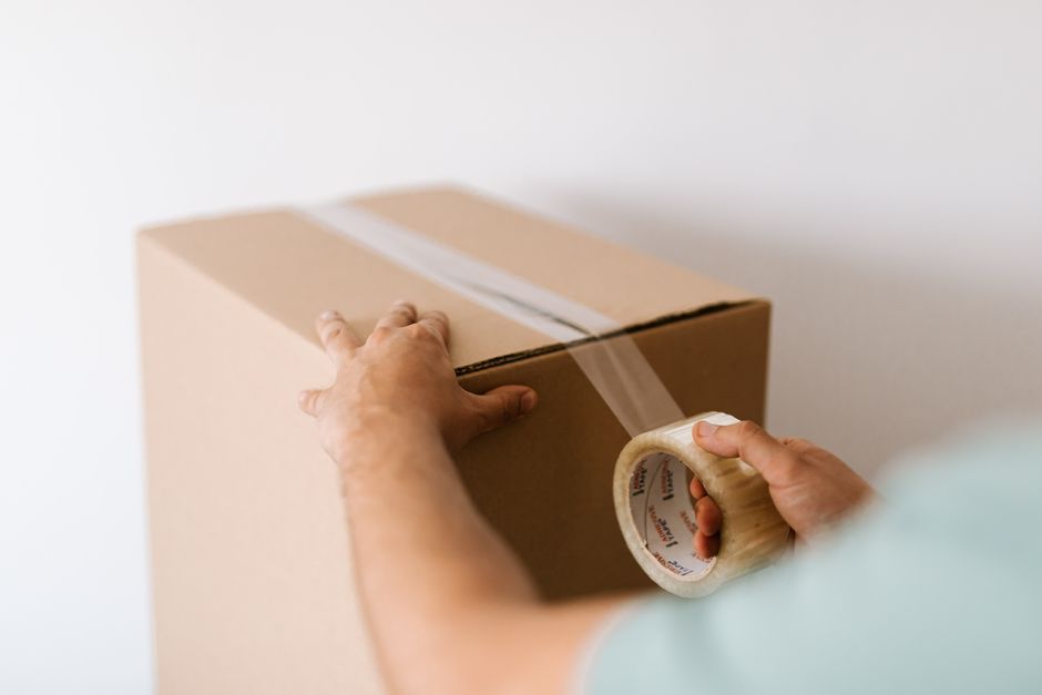 Shipping Personal Belongings To Canada Customs Declaration Quotes form and packing boxes beside passport